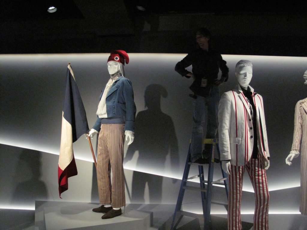 Photograph of Peter Hermon installing lighting in exhibition 